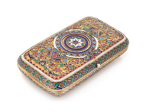 * A Russian Silver-Gilt and Enamel Cigarette Case, Mark of Pavel Ovchinnikov with Imperial Warrant, Moscow 1875, one side of the