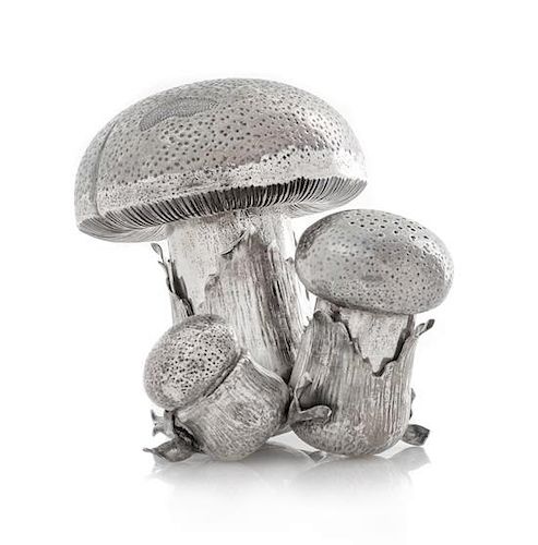 An Italian Silver Caster Set, Buccellati, Milan, 20th Century, in the form of a troop of mushrooms.