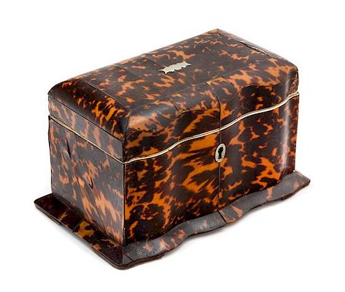 * An English Silver-Lined Tortoise Shell Tea Caddy Height 4 x width 7 1/4 inches.