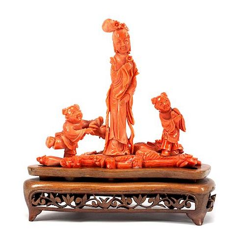 A Chinese Carved Coral Figural Group Width 6 1/4 inches.
