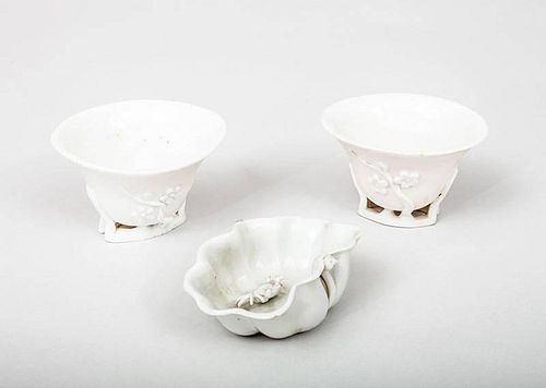 Pair of Chinese Ivory-Glazed Porcelain Rhino Horn-Form Cups and a Lotus Leaf Washer
