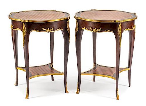 A Pair of Louis XV Style Gilt Bronze Mounted Parquetry Tables Height 28 x diameter of top 23 inches.