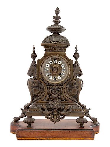 * A French Neoclassical Bronze Mantel Clock Height 17 x width 14 1/2 x depth 7 1/4 inches.