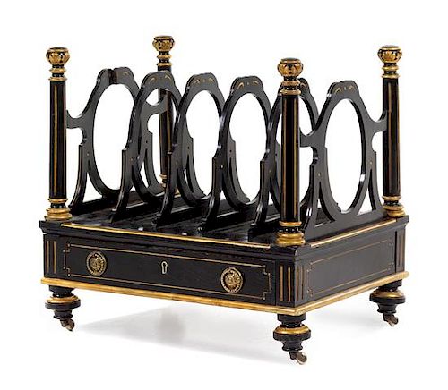 A Continental Ebonized and Parcel Gilt Canterbury Height 19 x width 19 1/2 x depth 13 1/2 inches.