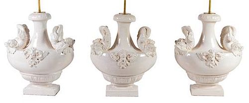 Two Pairs of Italian White-Glazed Ceramic Lamps Height overall 35 inches.