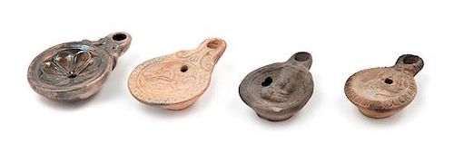 Three Roman Terra Cotta Oil Lamps Width of largest 3 1/2 inches.