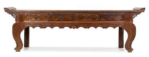 A Chinese Carved Walnut Altar Table Height 32 1/2 x width 108 x depth 18 1/2 inches.