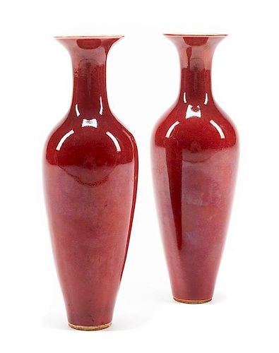 A Pair of Sang de Boeuf Porcelain Vases Height 9 1/2 inches.