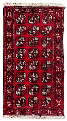 A Bokhara Wool Rug 6 feet 7 inches x 3 feet 10 inches.