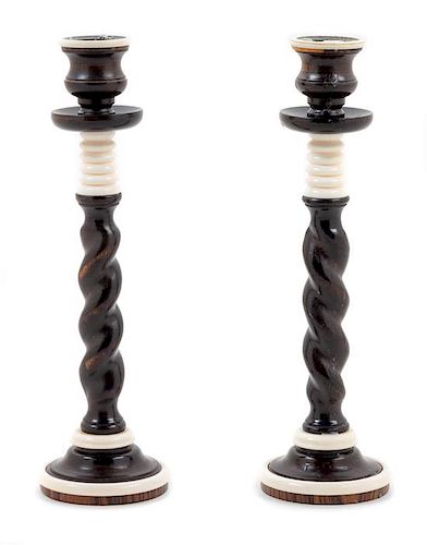 A Pair of Turned Ebony Candlesticks Height 9 1/4 inches.
