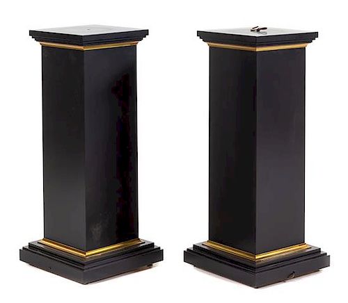 A Pair of Parcel Gilt Ebonized Pedestals Height 40 inches.