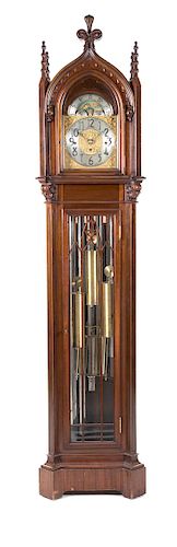A Gothic Revival Mahogany Tall Case Clock Height 83 x width 18 1/2 x depth 13 inches.