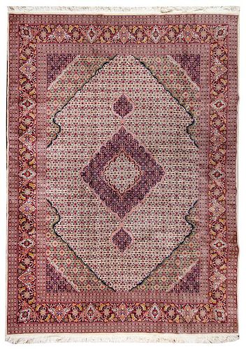 A Tabriz Wool and Silk Rug 12 feet x 8 feet 11 inches.