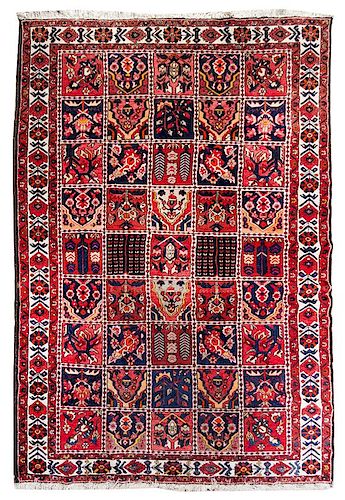 A Bakhtiari Wool Rug Approximately 7 feet x 10 feet.