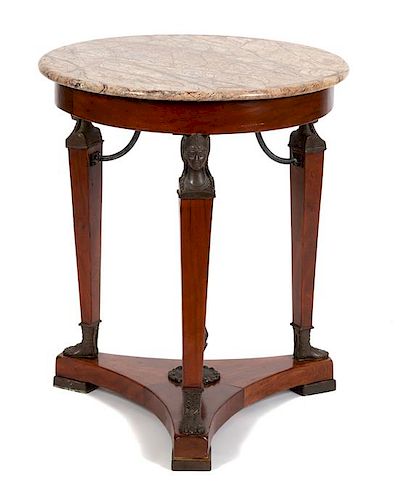 A French Empire Style Bronze Mounted and Marble Top Gueridon Height 28 1/2 x diameter 24 inches.