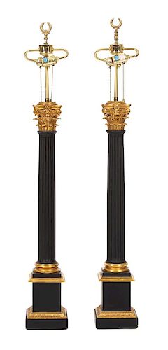 A Pair of Neoclasscial Style Ebonized and Gilt Metal Columnar Table Lamps Height 46 inches.