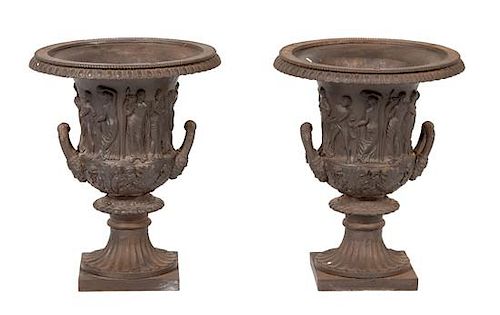 A Pair of Italian Cast Iron Garden Urns Height 20 x diameter 15 inches.