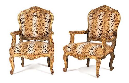 A Pair of Louis XV Style Carved Giltwood Fauteuils Height 43 1/2 inches.