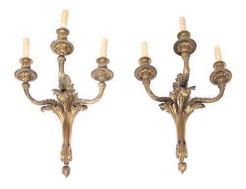A Pair of Louis XVI Style Gilt Bronze Three-light Wall Sconces Height 19 x width 16 inches.