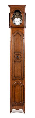 A French Provincial Carved Oak Tall Case Clock Height 102 inches.