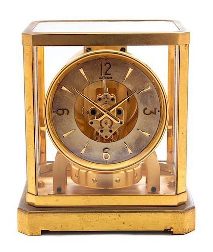 A Vintage LeCoultre Brass Cased Glass "Atmos" Clock Height 9 1/4 inches.