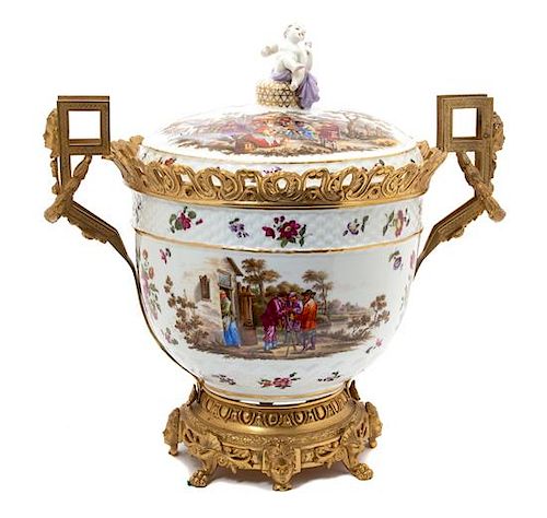 A Gilt Bronze Mounted German Porcelain Urn and Cover Height 20 inches.