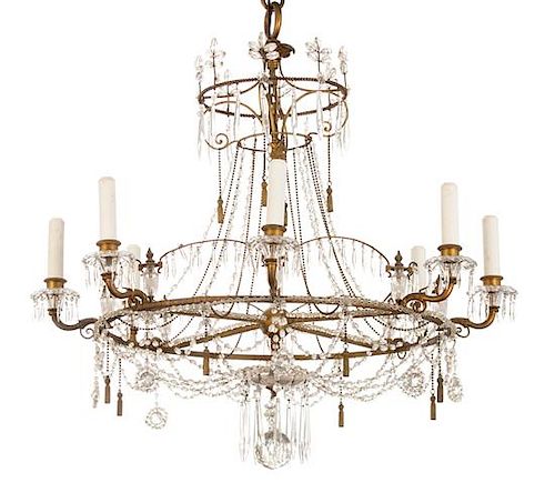 A Regency Style Gilt Metal and Crystal Eight-Light Chandelier Height 32 x diameter 31 inches.