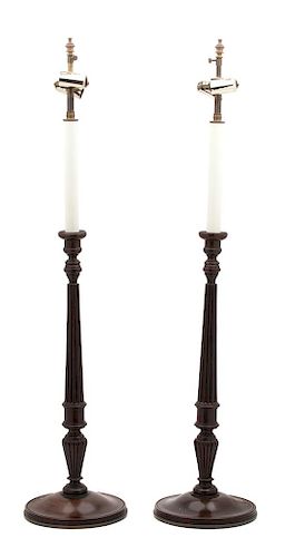 A Pair of English Mahogany Columnar-Form Candlesticks Height overall 34 inches.