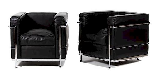 A Pair of Le Corbusier LC2 Petit Armchairs by Cassina Height 26 1/2 x width 30 x depth 28 inches.