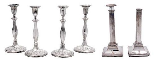 A Pair of Sheffield Plate Columnar Candlesticks and a Set of Four English Silverplate Candlesticks