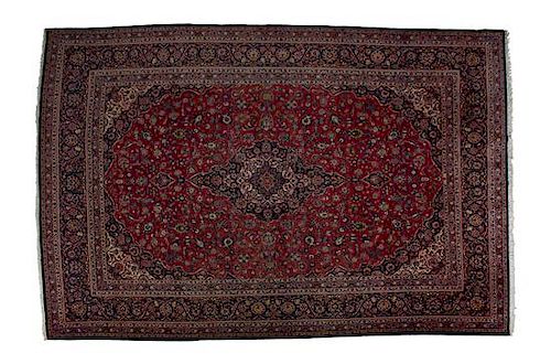 A Tabriz Wool Rug 14 feet 7 x 10 feet 4 1/2 inches.