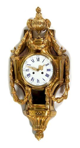 A Louis XV Style Gilt Bronze Cartel Clock Height 27 1/2 x width 12 1/2 inches.