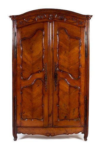A Louis XV Style Inlaid and Carved Walnut Armoire