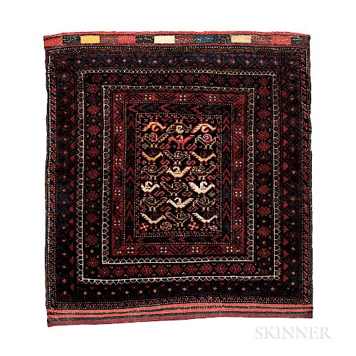 Baluch Bagface, eastern Iran, c. 1900, numerous silk highlights, 2 ft. 7 in. x 2 ft. 5 in.  Provenance:  The Cadle Collect...
