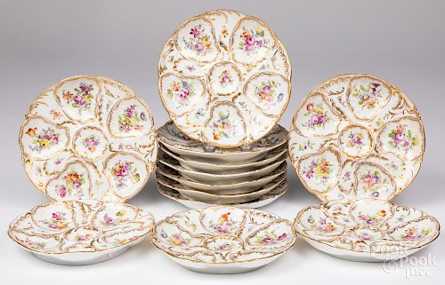 Set of twelve porcelain oyster plates