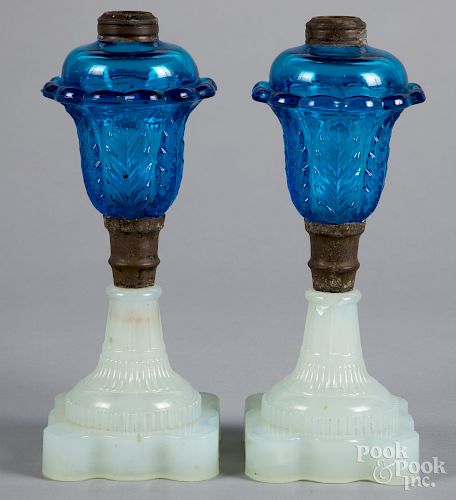 Pair of blue and clambroth glass fluid lamps