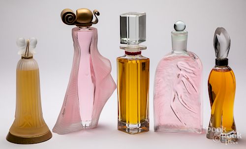 Five glass store display factice perfume bottles
