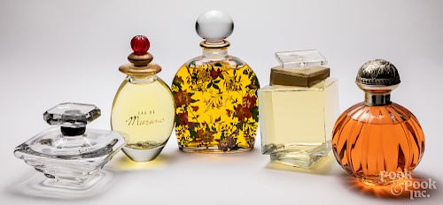Five glass store display factice perfume bottles
