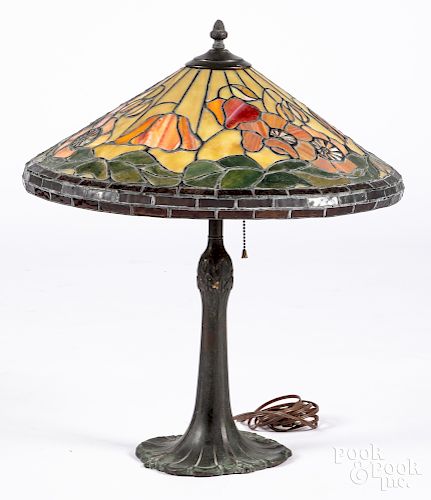 Patinated metal table lamp with leaded glass shade