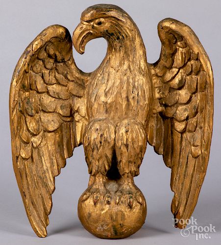 Carved and painted giltwood eagle finial