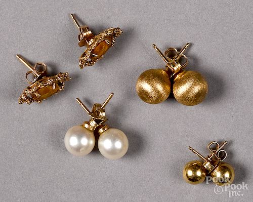 Four pairs of 14K yellow gold stud earrings