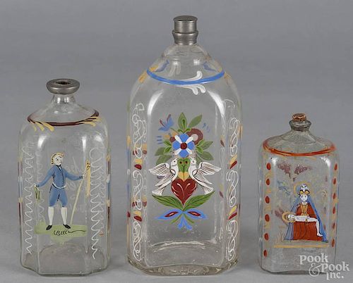 Three Stiegel-type enameled glass bottles, 19th c., 8'' h., 6'' h., and 5'' h.