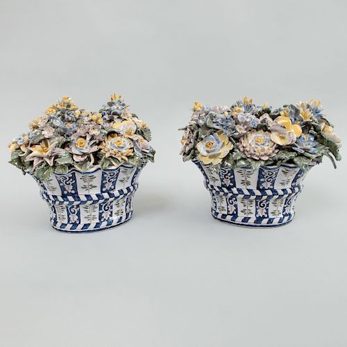 Pair  of Continental Faience Demilune Baskets of Flowers