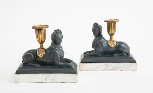 PAIR OF REGENCY SPHINX-FORM GILT AND VERTE ANTICO PLASTER CANDLE HOLDERS