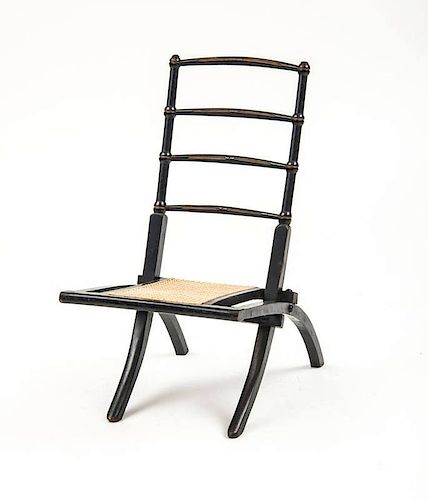 ENGLISH AESTHETIC MOVEMENT EBONIZED FOLDING CHAIR, IN THE MANNER OF E.W. GODWIN