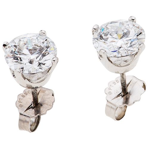 A diamond platinum pair of stud earrings.