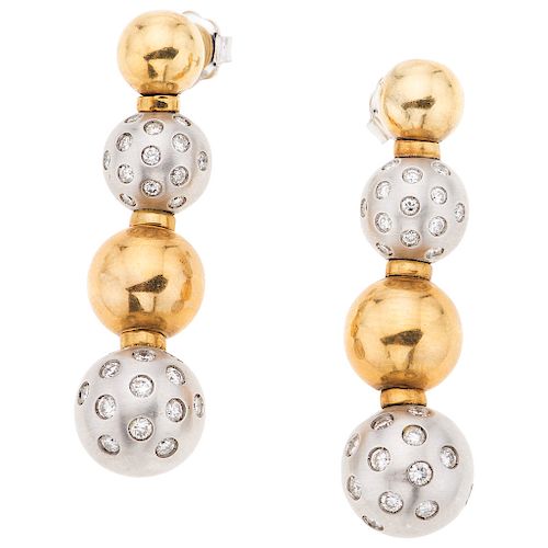 A diamond 18K yellow and white gold pair of earrings.
