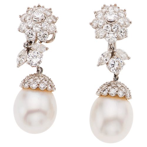 A cultured pearl and diamond 14K white gold and palladium silver pair of earrings.