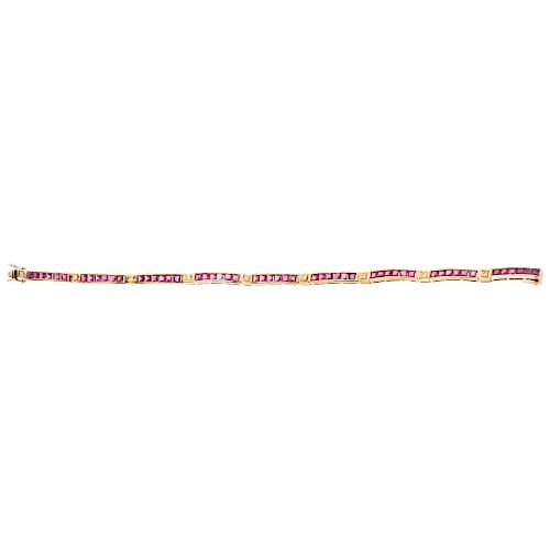 A ruby and diamond 14K yellow gold bracelet.