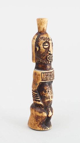 AFRICAN CARVED AND STAINED BONE FIGURE OF A STANDING MALE